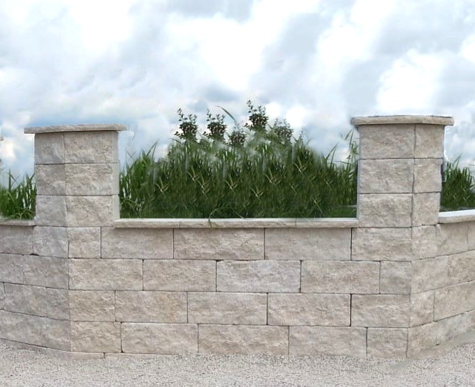 Helle Trockenmauer mit Pfeilern und dahinter wachsenden Ziergräsern